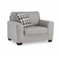Gray armchair with a patterned pillow on a white background