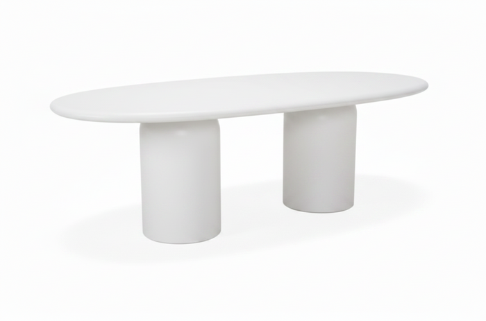 Modern white concrete dining table with cylindrical legs on a white background
