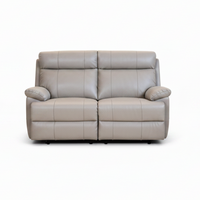 A two-seater power reclining loveseat sofa upholstered in light taupe leather, shown from the front against a plain white background.