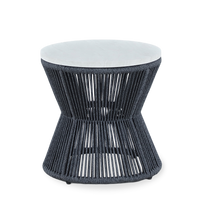 A modern round side table with a dark gray woven rope base and a light gray cushioned top, shown against a plain white background.