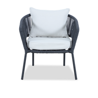 A modern outdoor armchair with a dark gray woven frame and three white cushions, shown against a plain white background.