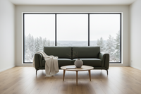 A green, leather 2 seater sofa with a contemporary design, featuring clean lines and minimalist detailing.